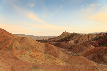 Fototapeta na wymiar Coloured sands at the bottom of the Big Crater HaMakhtesh HaGadol