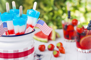 Red-white-and-blue popsicles on an outdoor table