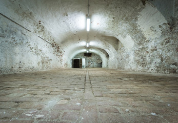 Basement of old fortress with vaulted brick ceiling - ancient du
