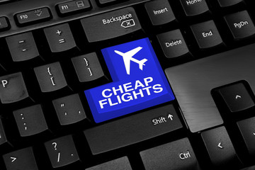Computer keyboard with blue cheap flights button