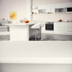 Wooden board on kitchen background