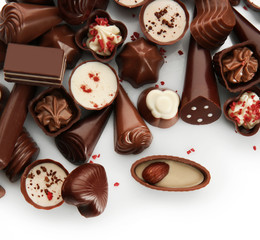 Assorted chocolate candies, isolated on white
