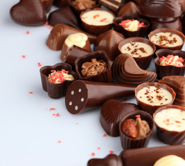 Assorted chocolate candies, isolated on white