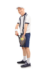 Senior man playing tennis