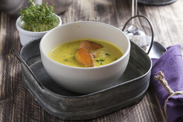curry sweet potato soup with shrimp on vintage table