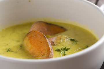 curry sweet potato soup with shrimp on vintage table