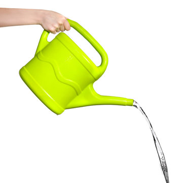 Female Hand Pouring Water From Green Plastic Watering Can, Isolated On White