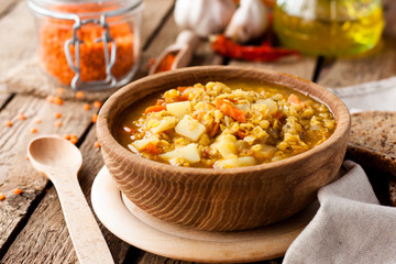 lentil soup in a wooden bowl