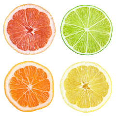 Obraz premium Slices of grapefruit, lime, lemon, orange isolated on white with clipping path