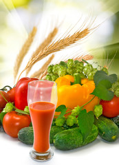 image of tomato juice and vegetables on sun background