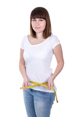young beautiful plus size woman measuring waist line isolated on