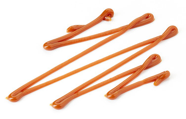 Caramel sauce on white background