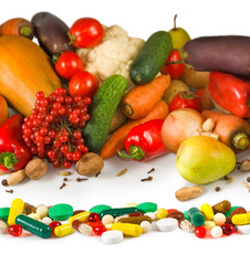 image of different vegetables and pills closeup