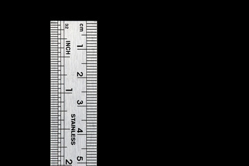 Used Engineers Steel Ruler on a Black Background
