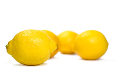 Fresh organic lemons, isolated on white background.