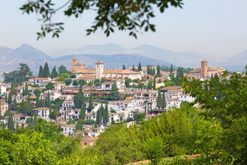 Fototapeta na wymiar Granada - The look to The Albayzin district and Saint Nicholas church from Generalife gardens