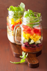Fototapeta na wymiar vegan quinoa bean vegetable salad in mason jars