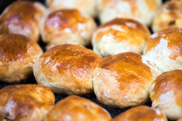 Butter ruddy pies on a baking sheet on the board