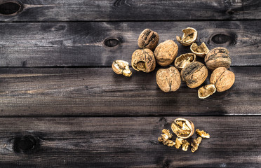 Walnuts on a wooden background.