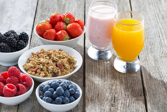healthy breakfast with fresh berries on wooden background
