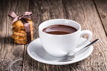 Photo sur Aluminium Chocolat Hot chocolate with homemade oat cookies in satin ribbon.