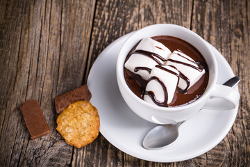 Cup of hot chocolate with marshmallow and candies