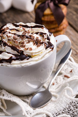 Cup of hot cappuccino with homemade oat cookies for breakfast.