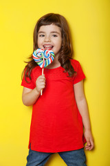 Sweet girl enjoying lollipop