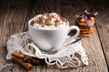 Cup of hot cappuccino with homemade oat cookies for breakfast.