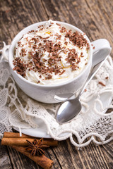 Cup of hot cappuccino with cinnamon for breakfast.