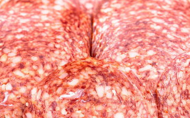 Background, texture of salami slices, close-up