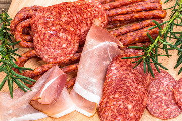 Assortment of meat. Ham, salami, sausage and prosciutto slices