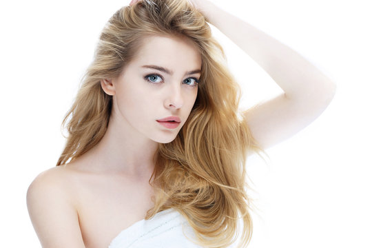 Beautiful girl with beautiful makeup, youth and skin care concept / photo of attractive blonde girl on white background