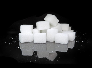 Sugar cubes on black background. Low key close-up.