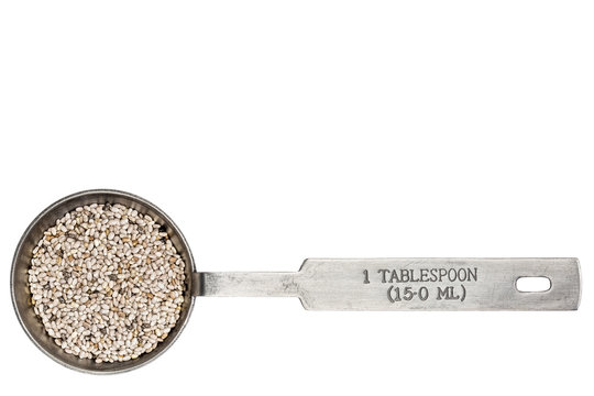 white chia seeds in a tablespoon