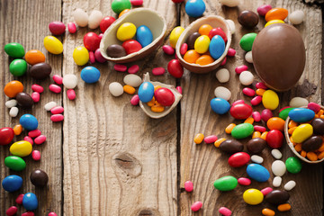 Fototapeta na wymiar Chocolate Easter Eggs Over Wooden Background