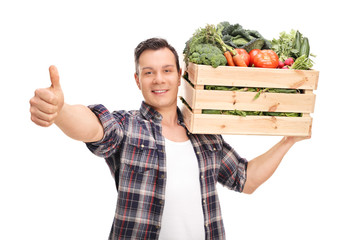 Farmer carrying a crate and giving a thumb up