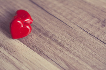 Photograph of two hearts on wooden surface