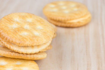 Cracker cream cheese on wooden table
