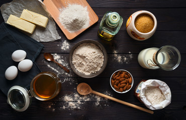 Fototapeta na wymiar Ingredients for baking on a wooden background top view