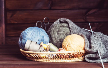 Fototapeta na wymiar knitting, tangles scissors and coils in a basket