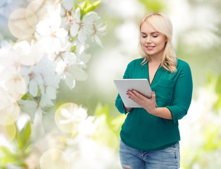 smiling woman with tablet pc computer