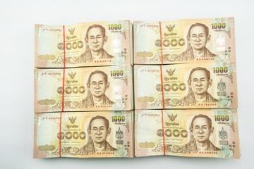 Fototapeta na wymiar stack of 1000 bath Thai money : Thailand Currency 1000 Bath, BankNotes isolated on white background. 
