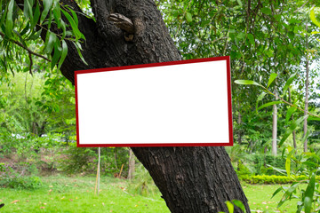 Blank billboard hanging on the tree