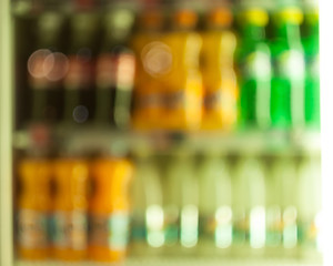 Blurry showcase with colorful bottles
