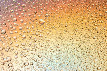 macro shot of liquid droplets with reflection. color background with water drops texture. gradient color