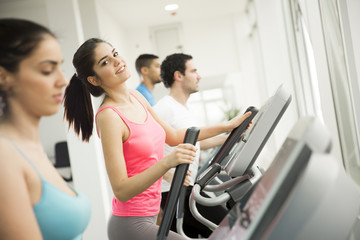 Fototapeta premium Young people training in the gym