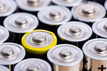 One is always different - group of batteries in row pattern