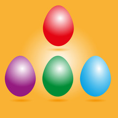 Set of colored eggs
set of four colored Easter eggs with shadow on orange background
