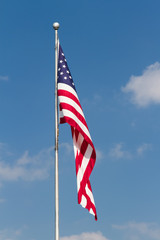 US Flag on Pole with Blue Sky
